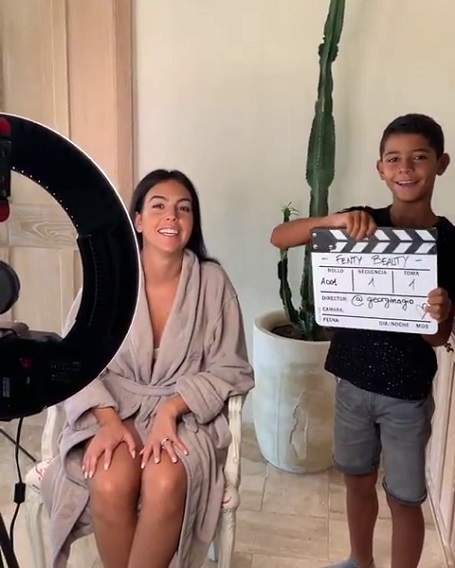 Cristiano Ronaldo Jr. with the clapperboard at the video tutorial shooting of Fenty Beauty.
